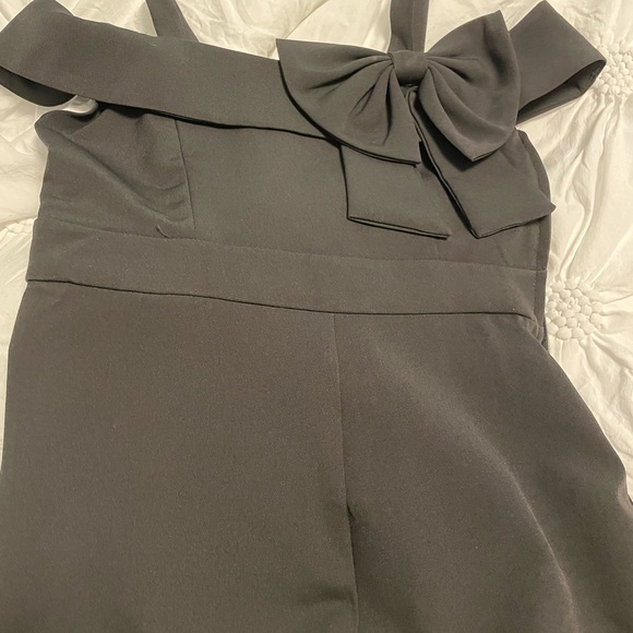 Girls size 8 jumpsuit in black with bow detailing - Picture 1 of 3